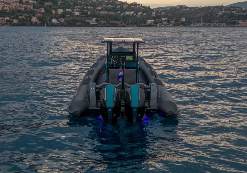 Slide: The Image of 2023 Roughneck 36 T Top boat on water at sunset, coastal background. - 49