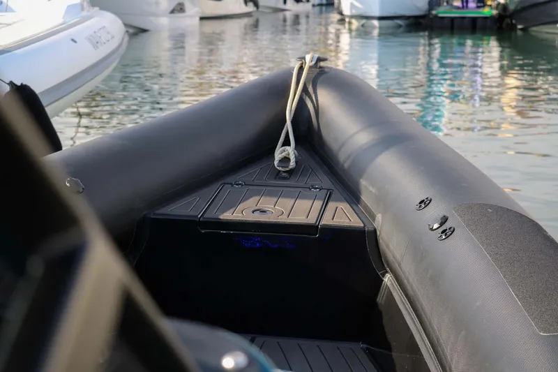 Slide: The Image of 2023 Roughneck 36 T Top boat, sleek design, docked in marina. - 5