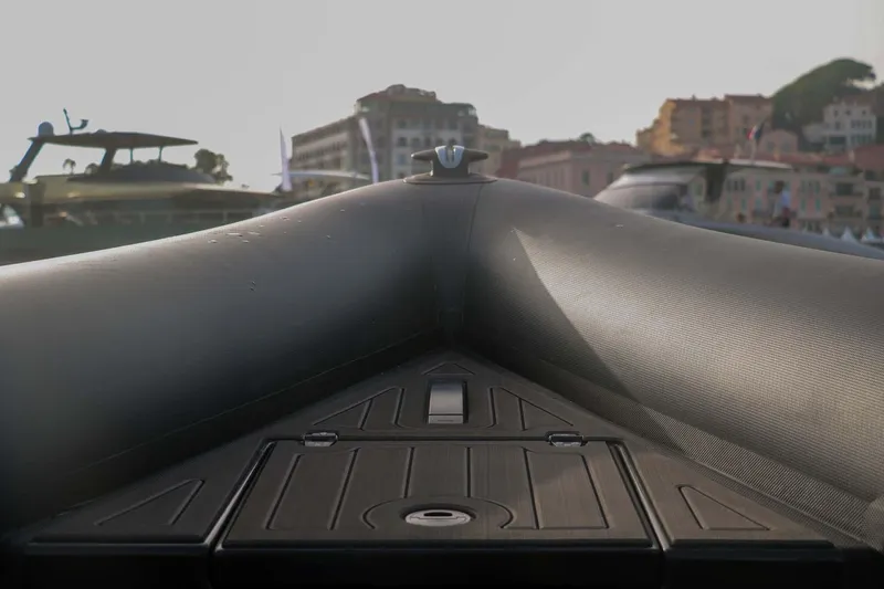 Slide: The Image of 2023 Roughneck 36 T Top boat bow with urban waterfront background. - 6