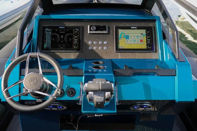 Slide: The Image of 2023 Roughneck 36 T Top boat dashboard with modern navigation displays and controls. - 8