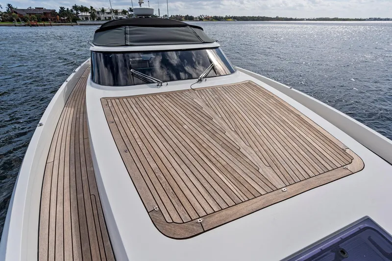 Slide: The Image of Sichterman Libertas 54 yacht 2021 with sleek wooden deck on calm water. - 31