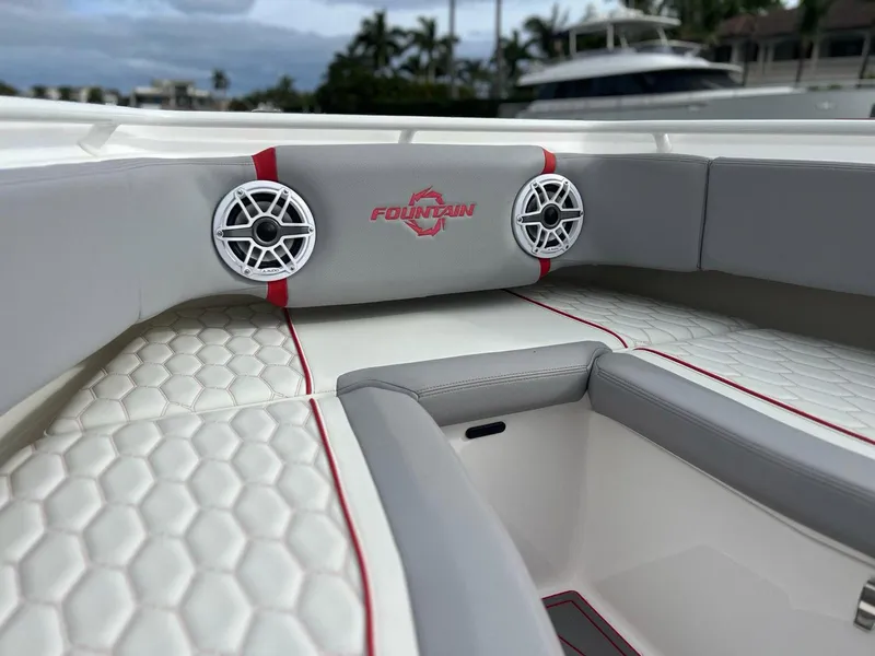 Slide: The Image of 2023 Fountain 38 SC boat interior with stylish seating and speakers. - 13