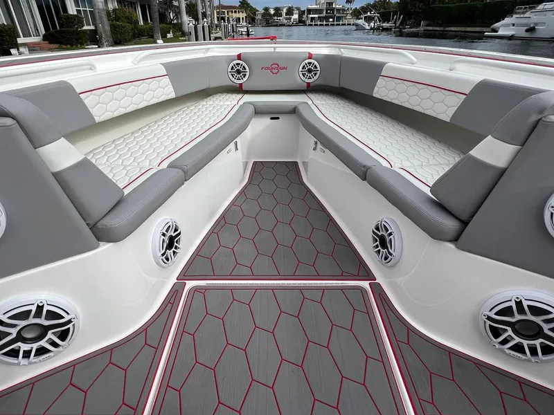 Slide: The Image of 2023 Fountain 38 SC boat interior with stylish seating and modern design. - 16