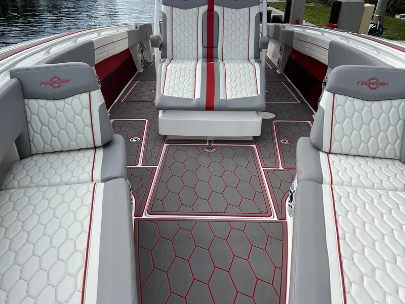 Slide: The Image of 2023 Fountain 38 SC boat interior with stylish seating and hexagonal pattern flooring. - 20