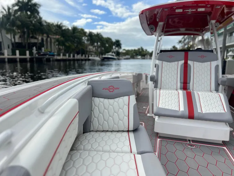 Slide: The Image of 2023 Fountain 38 SC boat interior with stylish seating and waterfront view. - 21