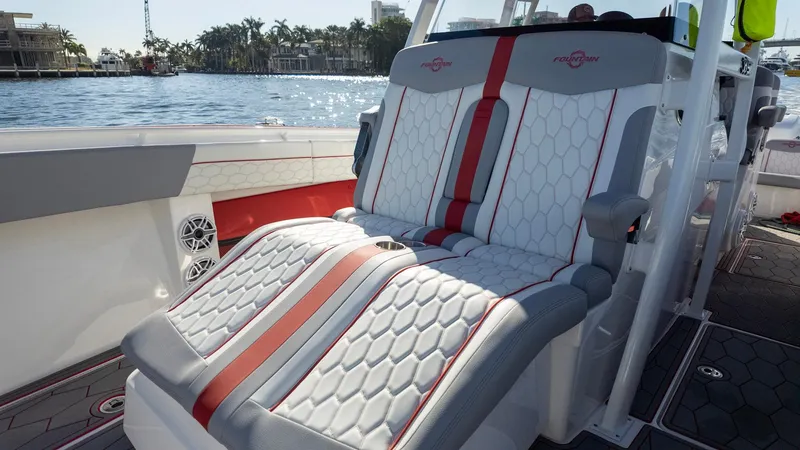 Slide: The Image of 2023 Fountain 38 SC boat with luxurious seating and stylish design on the water. - 22