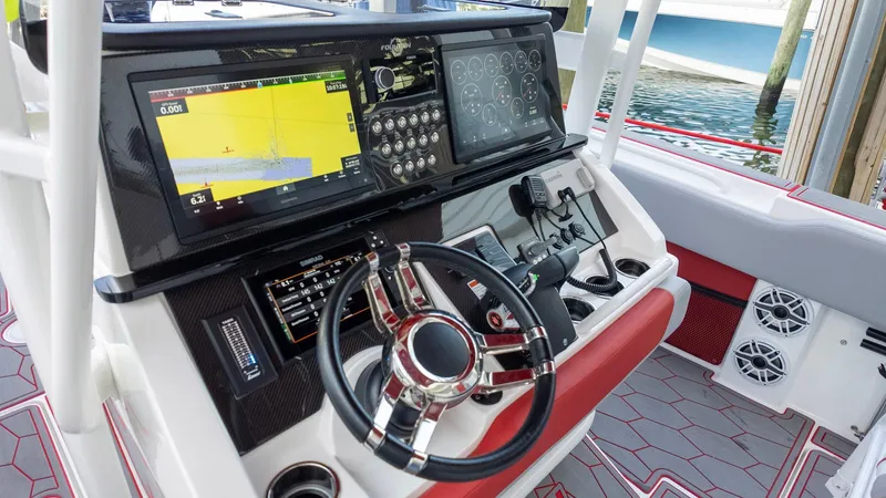 Slide: The Image of 2023 Fountain 38 SC boat dashboard with advanced navigation and control systems. - 27