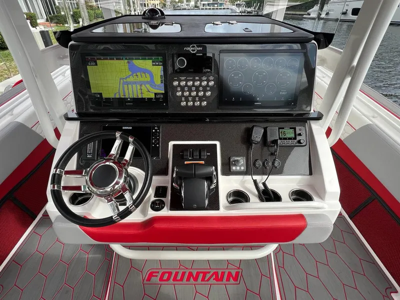 Slide: The Image of 2023 Fountain 38 SC boat dashboard with advanced navigation and control systems. - 28