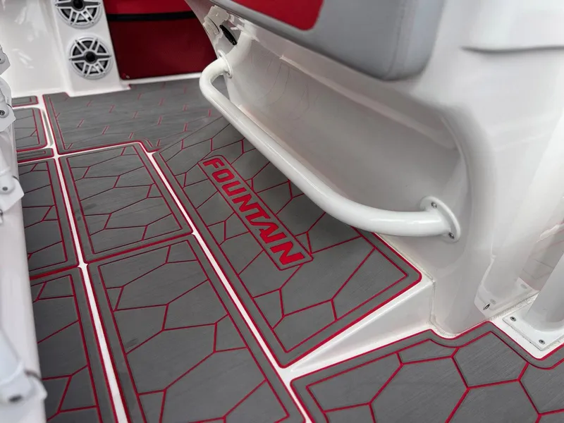 Slide: The Image of 2023 Fountain 38 SC boat interior with stylish red and gray flooring design. - 29