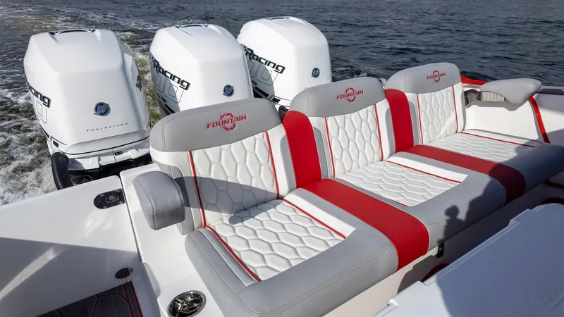 Slide: The Image of 2023 Fountain 38 SC boat with luxurious seating and powerful outboard engines. - 35