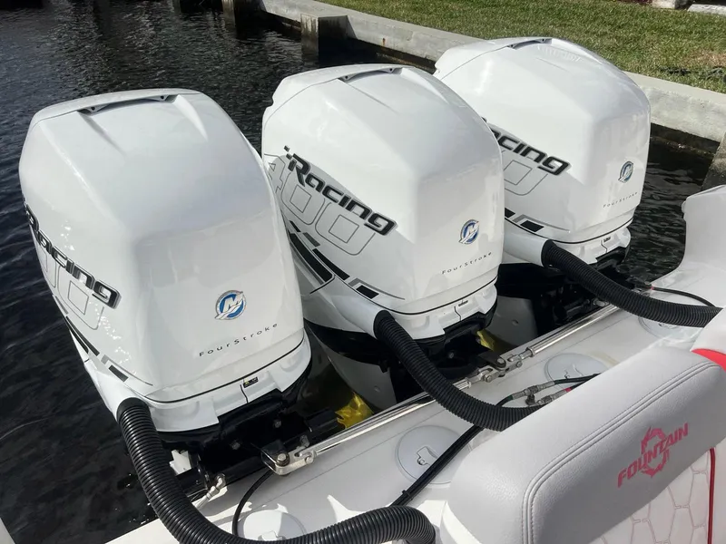 Slide: The Image of 2023 Fountain 38 SC boat with triple Mercury Racing outboard engines. - 43