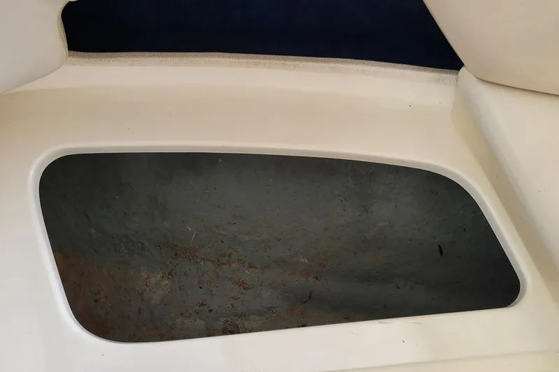 Slide: The Image of Storage compartment of a 1994 Sea Ray 180 Bow Rider boat. - 29