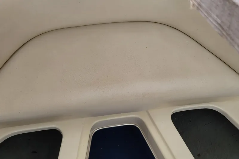 Slide: The Image of Interior view of a 1994 Sea Ray 180 Bow Rider boat, featuring seating area. - 31