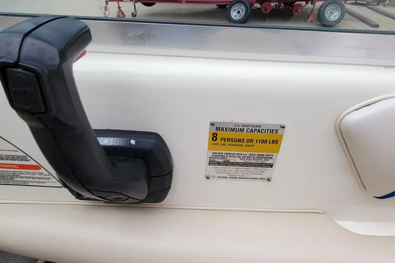 Slide: The Image of 1994 Sea Ray 180 Bow Rider capacity label, showing maximum of 8 persons or 1100 lbs. - 32