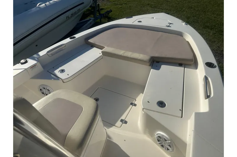 Slide: The Image of 2005 Pathfinder TRS boat interior with cushioned seating and storage compartments. - 10