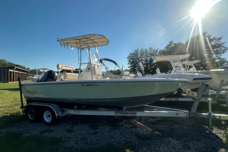 Slide: The Image of Pathfinder 2005 TRS boat on trailer, sunny day, grassy area, 2023 model. - 5