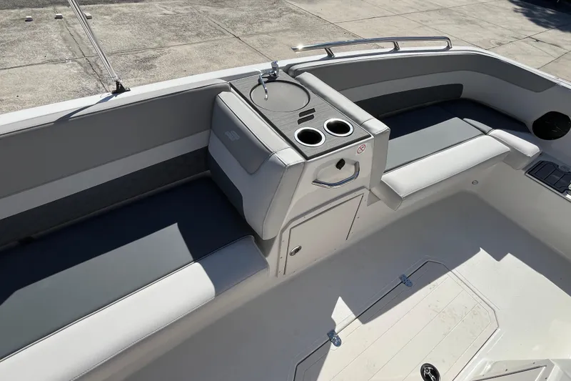 Slide: The Image of 2026 Starcraft SVX 211 OB boat interior with seating and cup holders. - 13