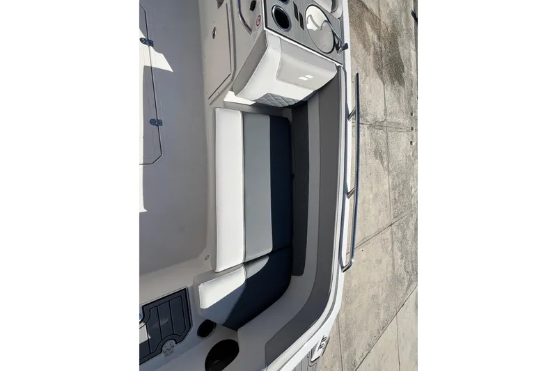 Slide: The Image of 2026 Starcraft SVX 211 OB boat interior with seating and storage compartments. - 18