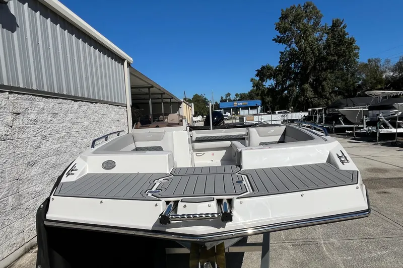 Slide: The Image of 2026 Starcraft SVX 211 OB boat displayed outdoors, showcasing sleek design and spacious seating. - 8