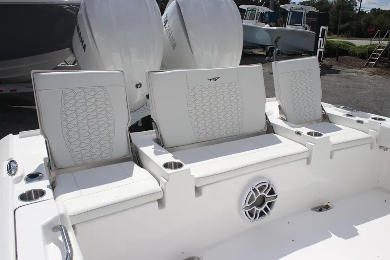 Slide: The Image of 2026 Tidewater 2700 Carolina Bay boat seats with cup holders and speaker. - 11