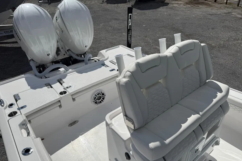 Slide: The Image of 2026 Tidewater 2700 Carolina Bay boat with dual Yamaha engines and cushioned seating. - 14