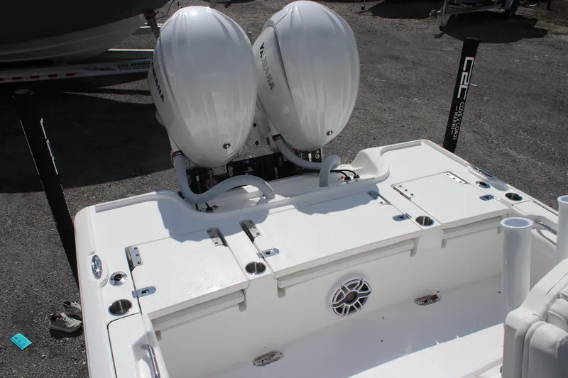Slide: The Image of 2026 Tidewater 2700 Carolina Bay boat with dual Yamaha outboard engines, rear deck view. - 9