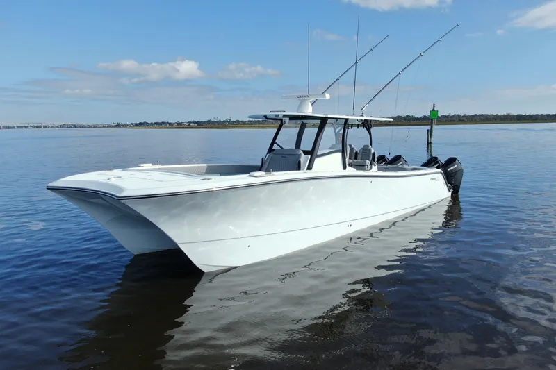 The Image of 2025 Front Runner 37 Catamaran on calm water, featuring sleek design and fishing rods. - 0