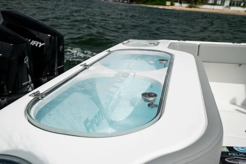 Slide: The Image of 2025 Front Runner 37 Catamaran with dual Mercury engines on the water. - 12