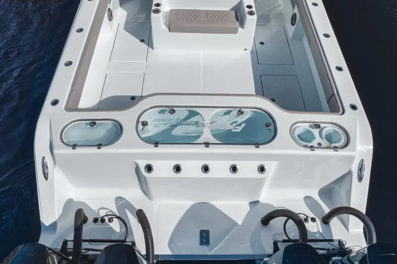 Slide: The Image of 2025 Front Runner 37 Catamaran, rear view, showcasing spacious deck and dual engines. - 13