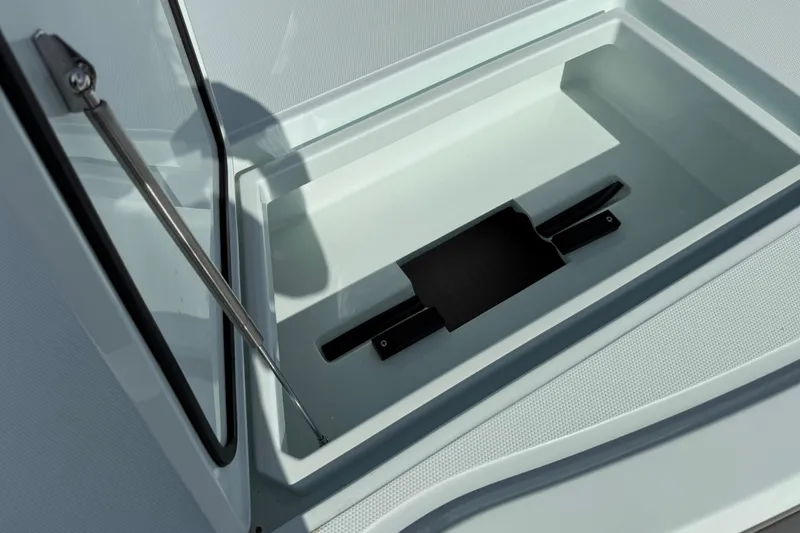 Slide: The Image of Open storage compartment on 2025 Front Runner 37 Catamaran, showcasing sleek design and functionality. - 16