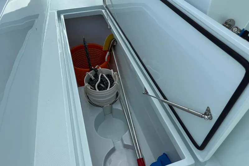 Slide: The Image of Storage compartment on 2025 Front Runner 37 Catamaran, featuring organized boating equipment. - 17