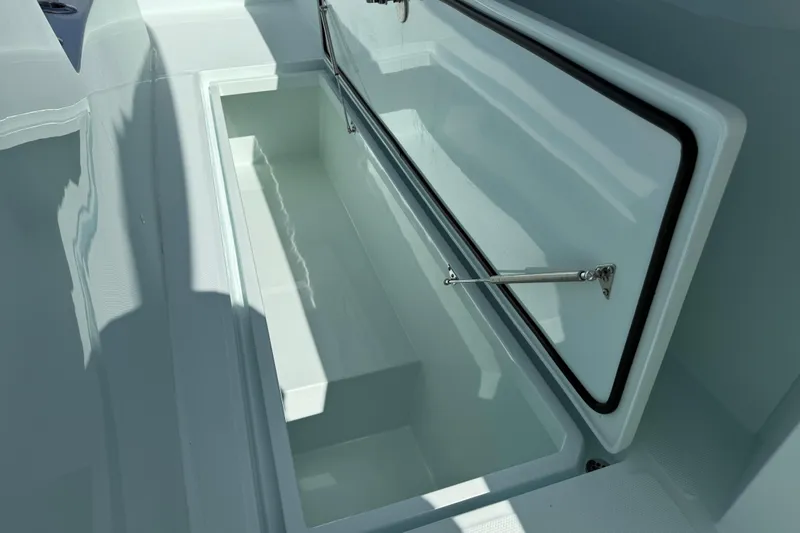 Slide: The Image of Open storage compartment on 2025 Front Runner 37 Catamaran boat deck. - 18