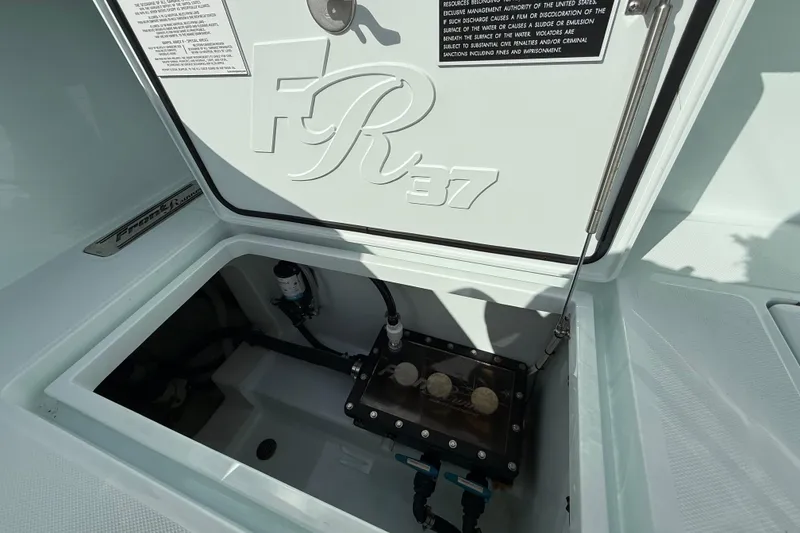Slide: The Image of Open hatch of 2025 Front Runner 37 Catamaran showing internal components. - 22