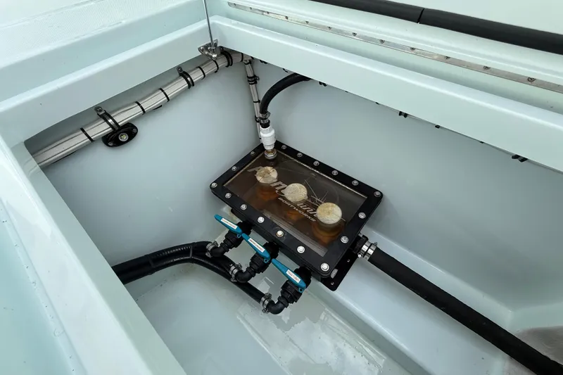 Slide: The Image of 2025 Front Runner 37 Catamaran engine compartment with visible fuel system components. - 23