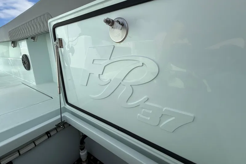 Slide: The Image of 2025 Front Runner 37 Catamaran, featuring sleek design and embossed logo detail. - 24