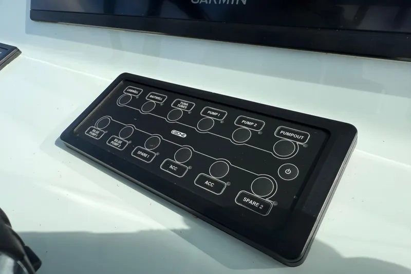 Slide: The Image of Control panel on 2025 Front Runner 37 Catamaran, featuring various pump and accessory switches. - 29