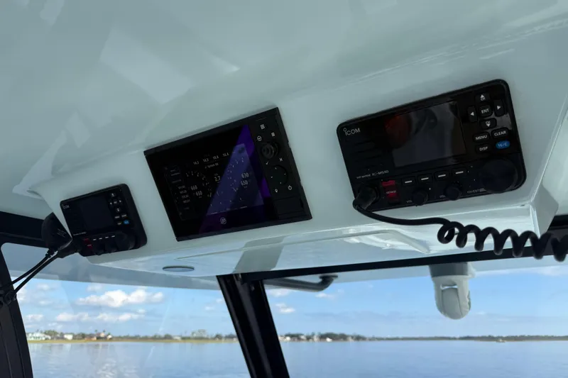 Slide: The Image of Control panel of 2025 Front Runner 37 Catamaran with navigation and communication systems. - 30