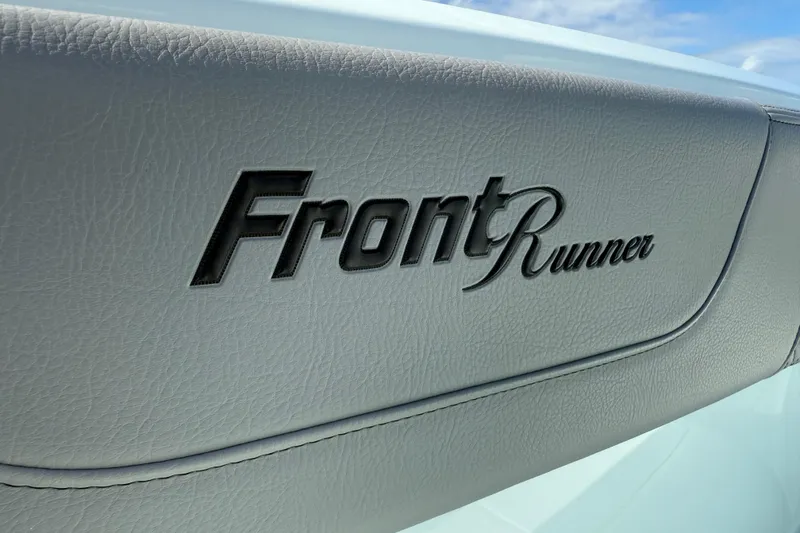 Slide: The Image of Front Runner 37 Catamaran 2025 logo on sleek leather interior. - 34