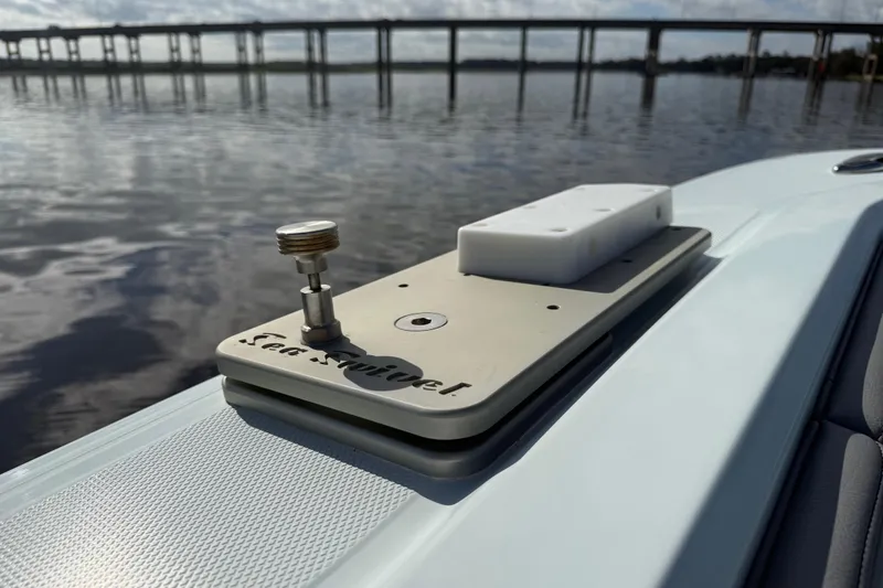 Slide: The Image of Close-up of a 2025 Front Runner 37 Catamaran deck detail with water and bridge in background. - 35
