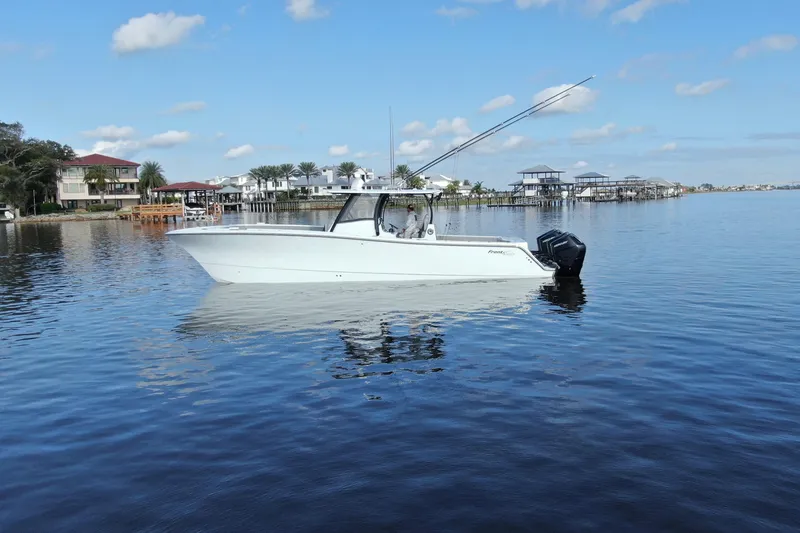 Slide: The Image of 2025 Front Runner 37 Catamaran on calm water, with coastal homes in the background. - 39