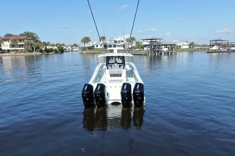 Slide: The Image of 2025 Front Runner 37 Catamaran on calm water, showcasing powerful engines and sleek design. - 41