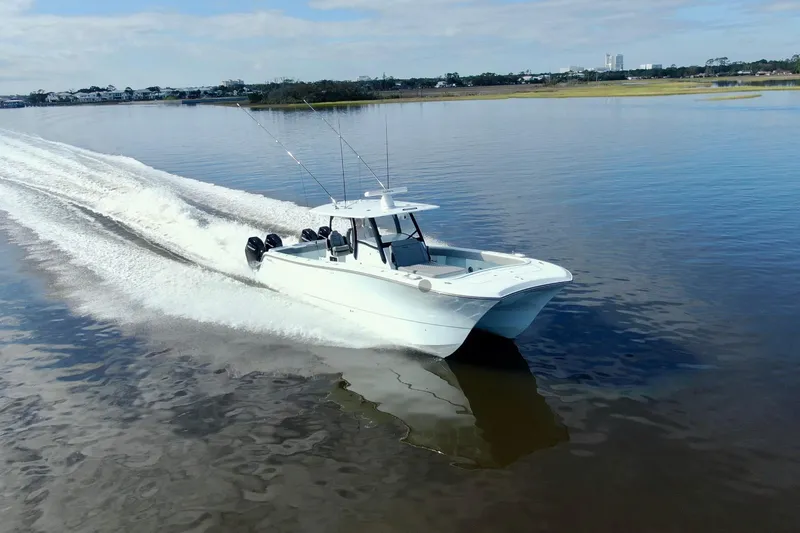 Slide: The Image of 2025 Front Runner 37 Catamaran cruising on calm waters, showcasing sleek design and powerful engines. - 47