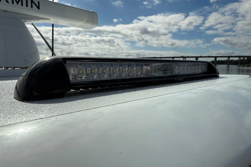 Slide: The Image of 2025 Front Runner 37 Catamaran with Razor LED light bar, under a cloudy sky. - 54