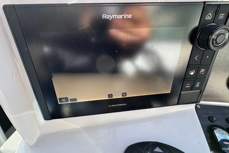 Slide: The Image of Raymarine navigation display on 2020 Rinker 320 EX boat dashboard. - 11