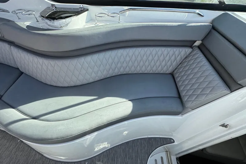 Slide: The Image of Luxurious seating area on a 2020 Rinker 320 EX boat with quilted upholstery. - 16
