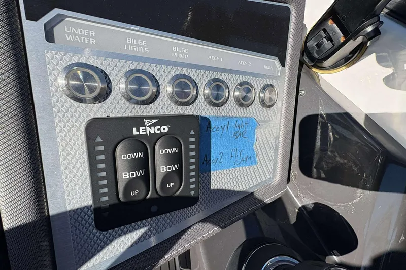 Slide: The Image of Control panel of a 2020 Monterey 305SS Super Sport boat with Lenco trim tab switches. - 14