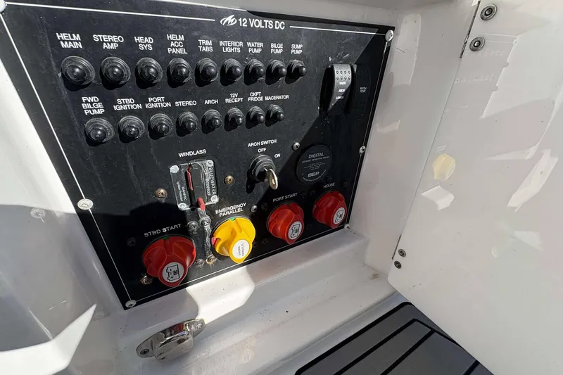 Slide: The Image of Control panel of a 2020 Monterey 305SS Super Sport boat with various switches and dials. - 18