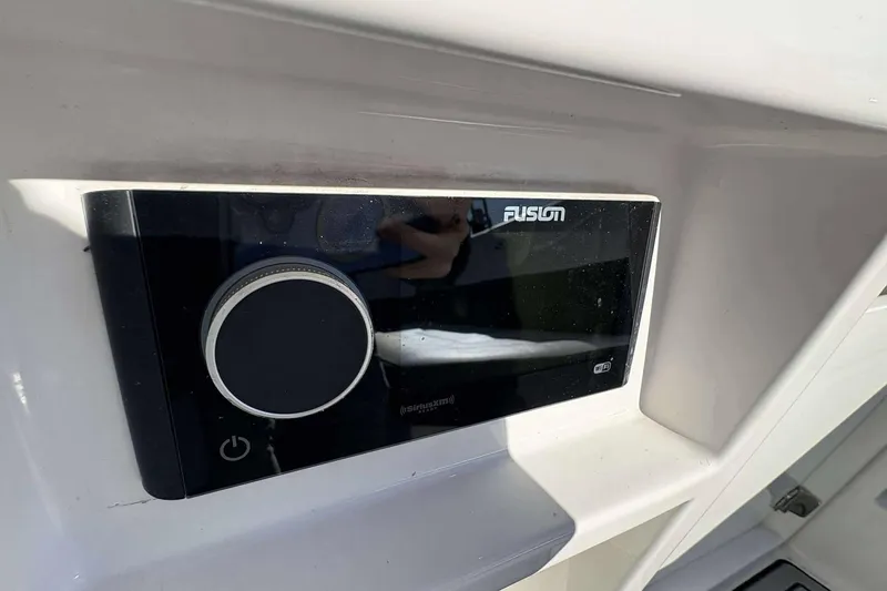Slide: The Image of Fusion audio system on 2020 Monterey 305SS Super Sport boat dashboard. - 19