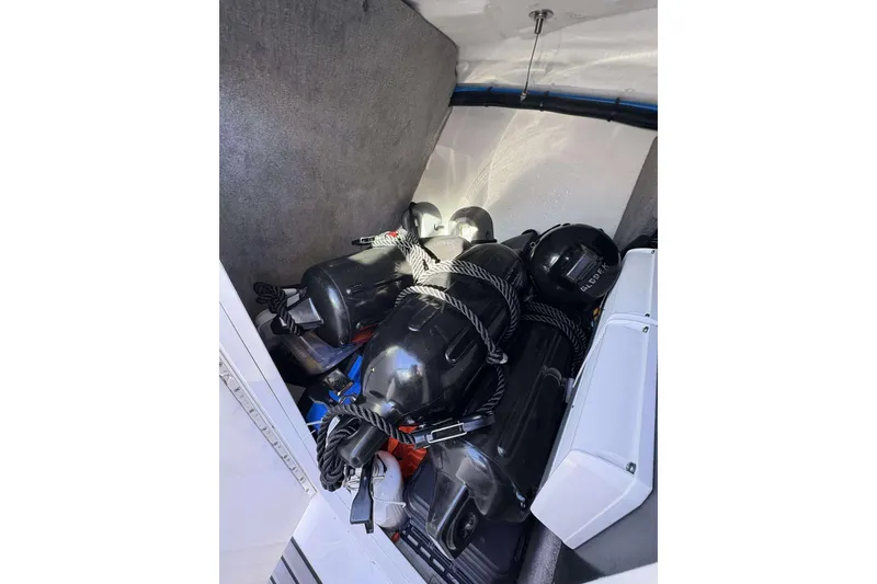 Slide: The Image of Storage compartment of 2020 Monterey 305SS Super Sport with black fenders and ropes. - 22