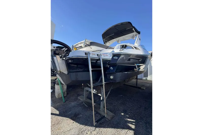 Slide: The Image of 2020 Monterey 305SS Super Sport boat on dry dock with ladder access. - 26